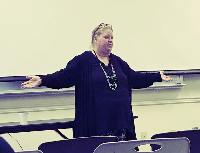 Julie Anne Kempf giving a presentation at our February Meeting on the Primary Caucus Debate