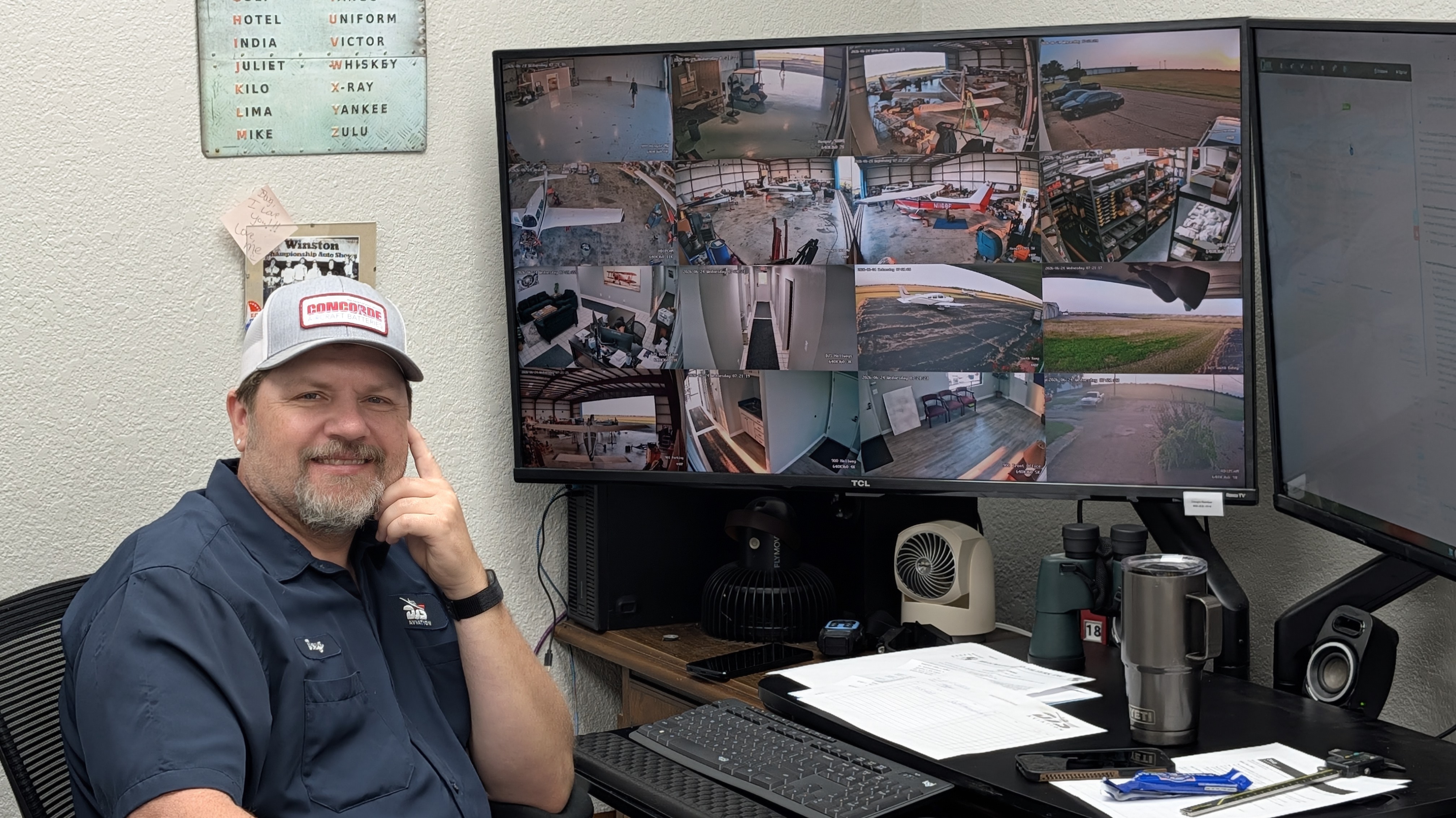 Doug Kahanek at his desk — DJS Aviation Operations Manager monitoring hangar and ramp cameras