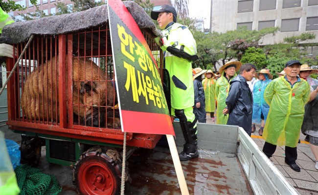 Dog meat farmers protest for survival rights near National Assembly