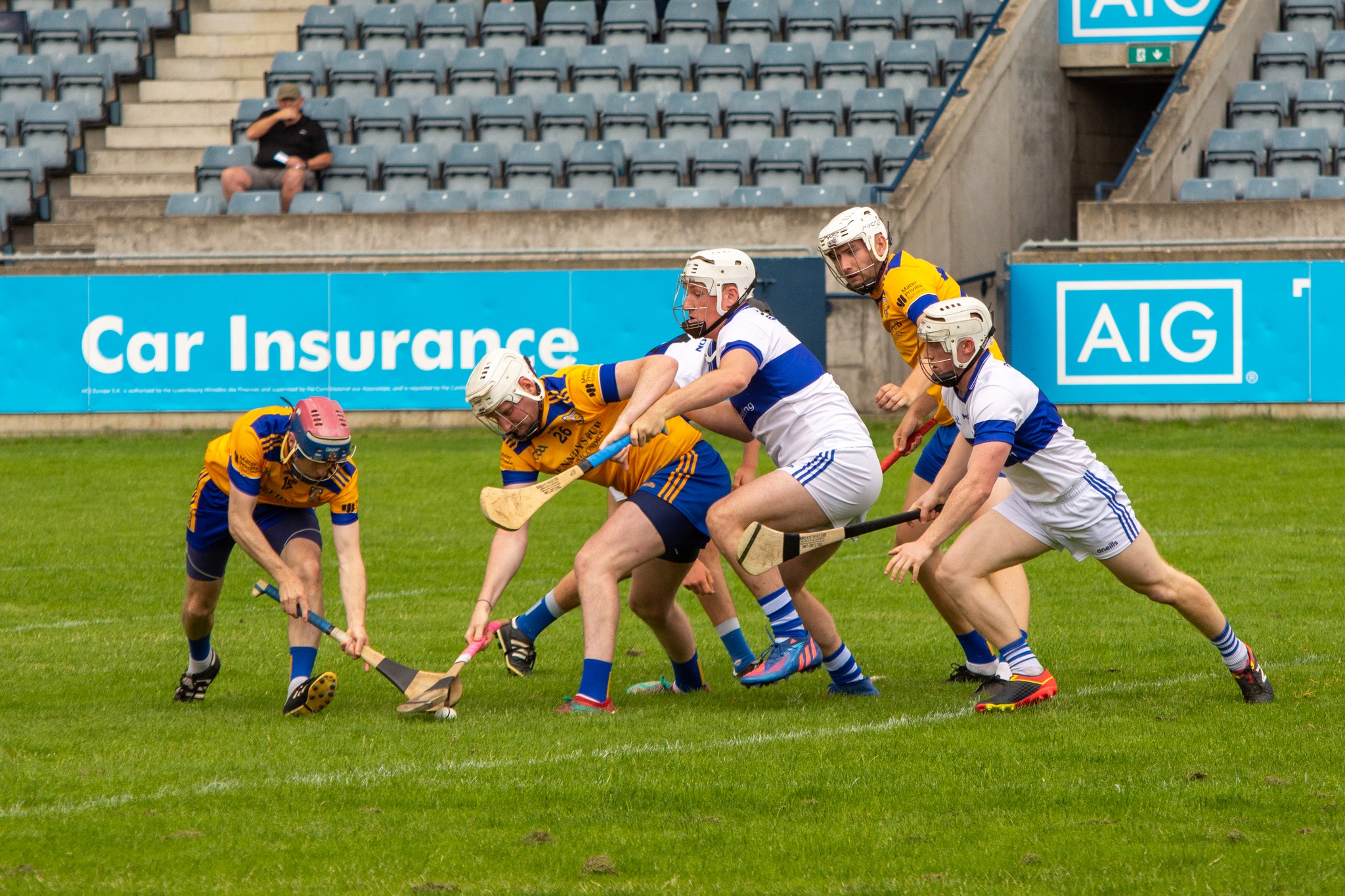 Two teams of hurling contesting a ball