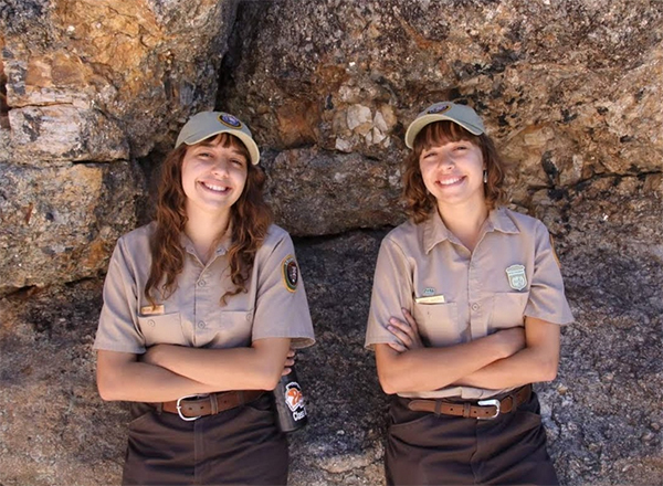 Brooke on right and twin sister on left at Mount Rushmore in 2016
