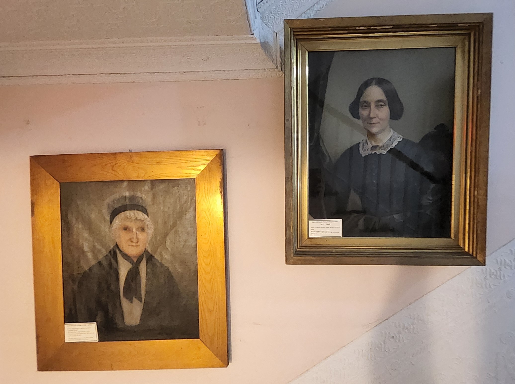 Portraits of Lucy Winters Potter (left) and Lucy Winters Alexander Humes (right) on a wall of the Miles-Humes House. The wall is beside the main staircase leading to the second floor.