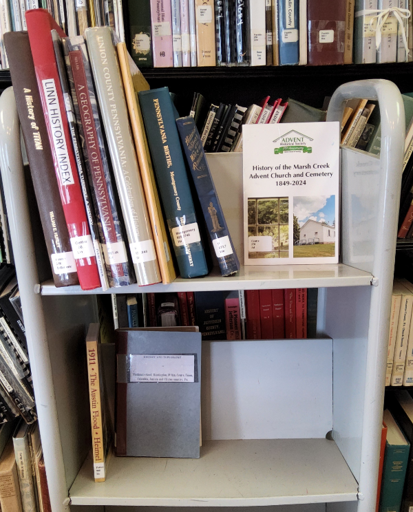 New books at the PA Room on a rolling cart.
