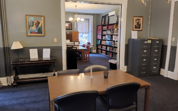 View of the right side wall (shared with the Spangler Room) of the Miller Room on the first floor of the Miles-Humes House. Pictures of John Black Miller and Elizabeth Miller are on the wall.