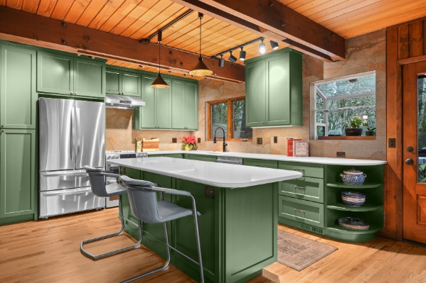 Professional interior photograph of a green kitchen