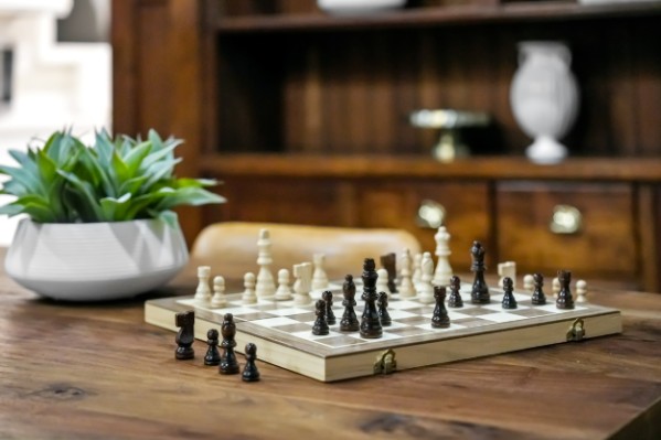 Chessboard arranged on a table in a vacation rental gathering space