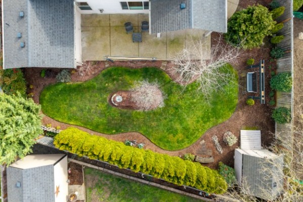 Residential drone view showing exterior angles and landscaping