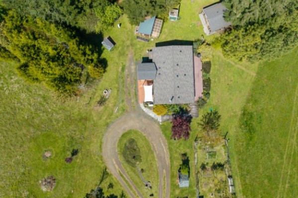 Acreage drone view showing land and surrounding context