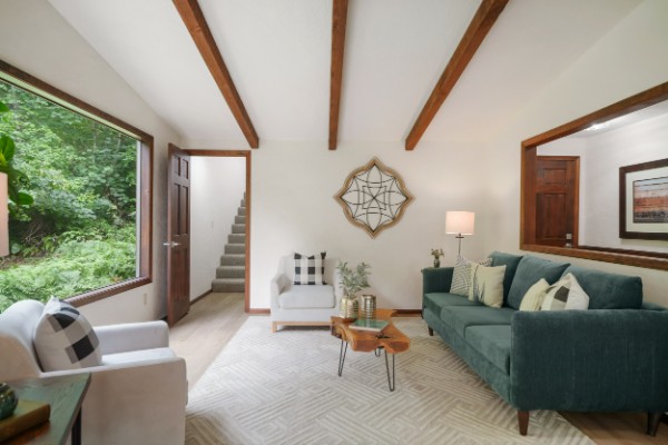 Living room with a vaulted ceiling and exposed beams