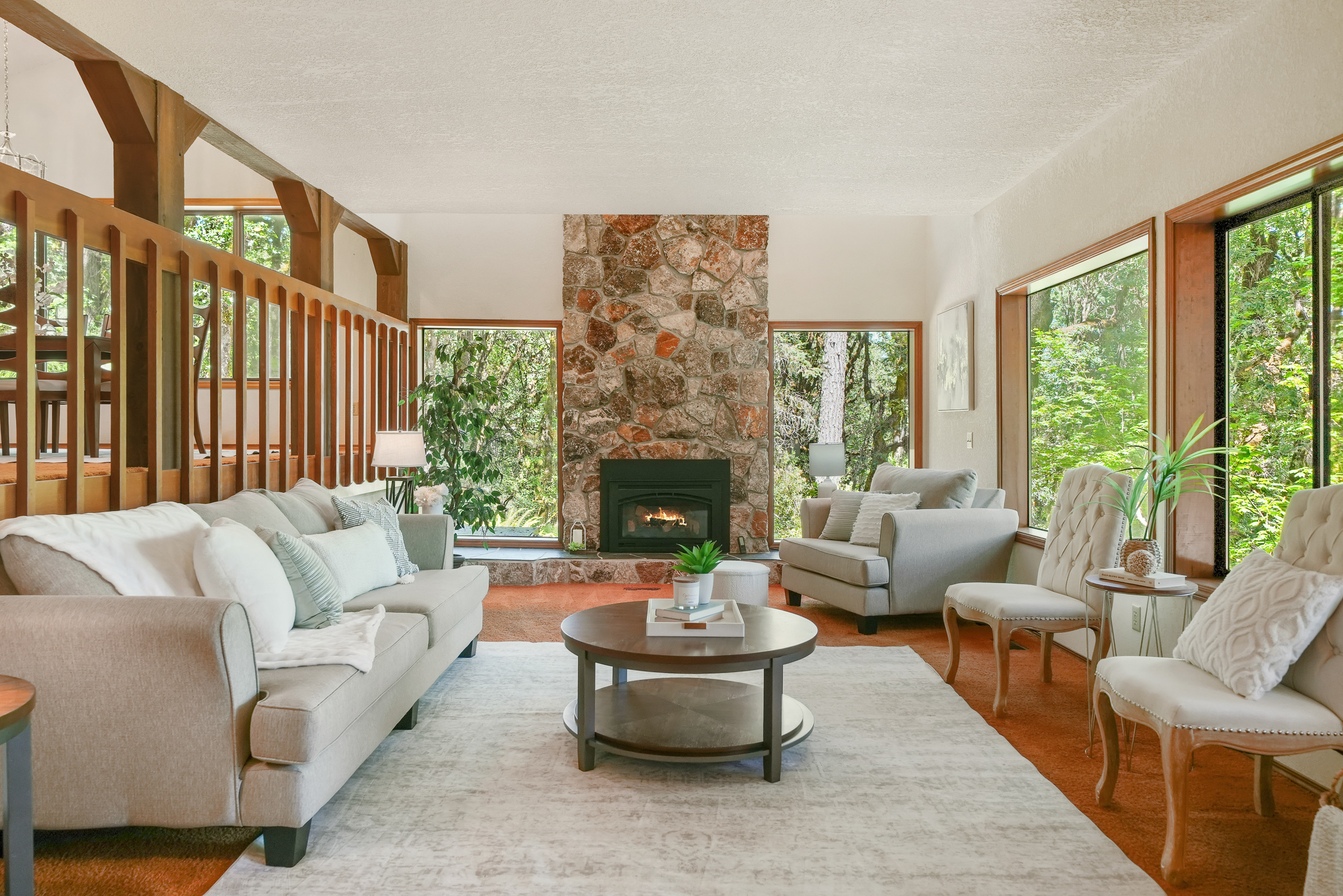 Hilltop custom home with expansive forest-facing windows