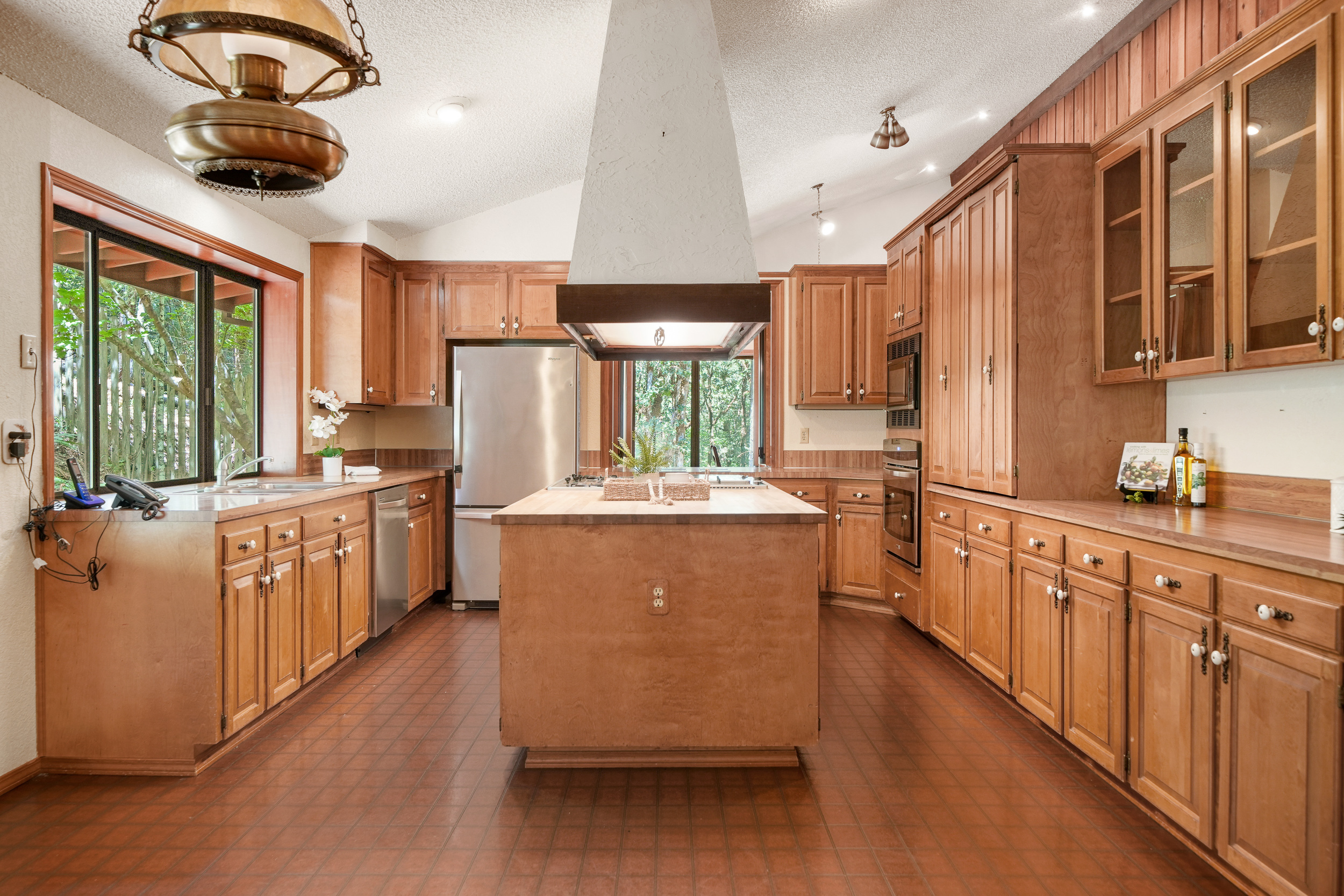 Large kitchen with a built-in range and dining-room passthrough