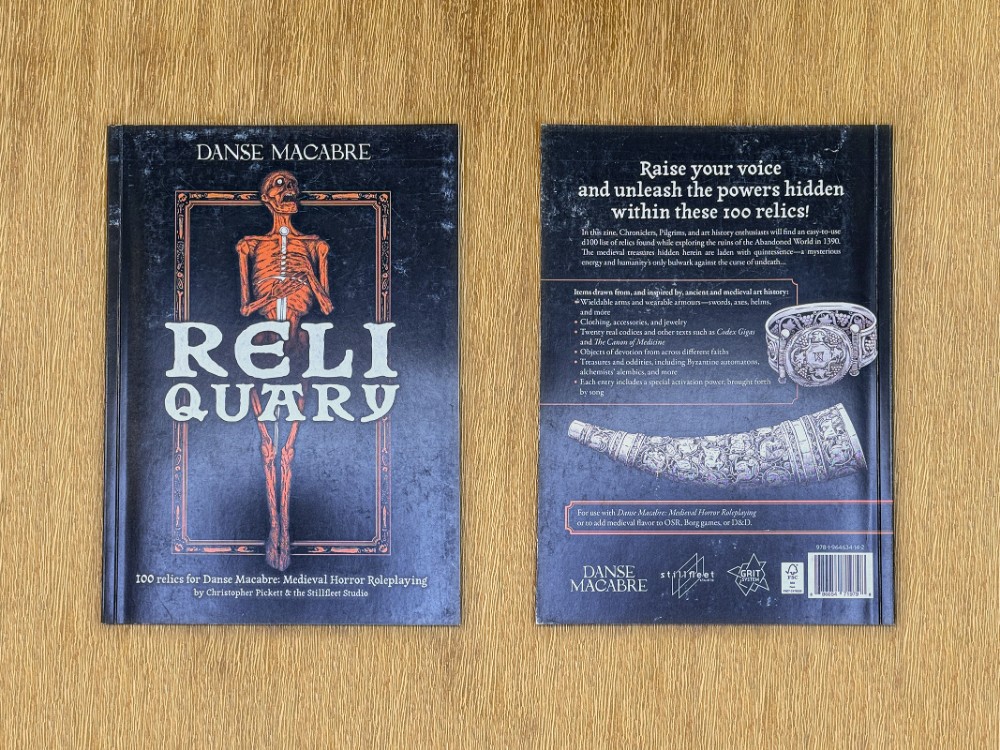 Uneven black-ink distribution on the front and back covers of the Reliquary zine for Danse Macabre by Christopher Pickett