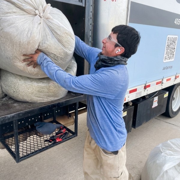 Crew loading SuperLawn Truck